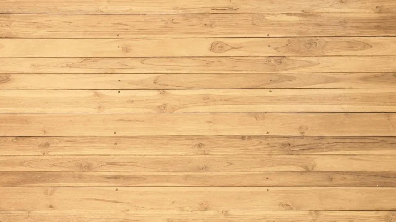 Lames de bois clair juxtaposees formant un plancher